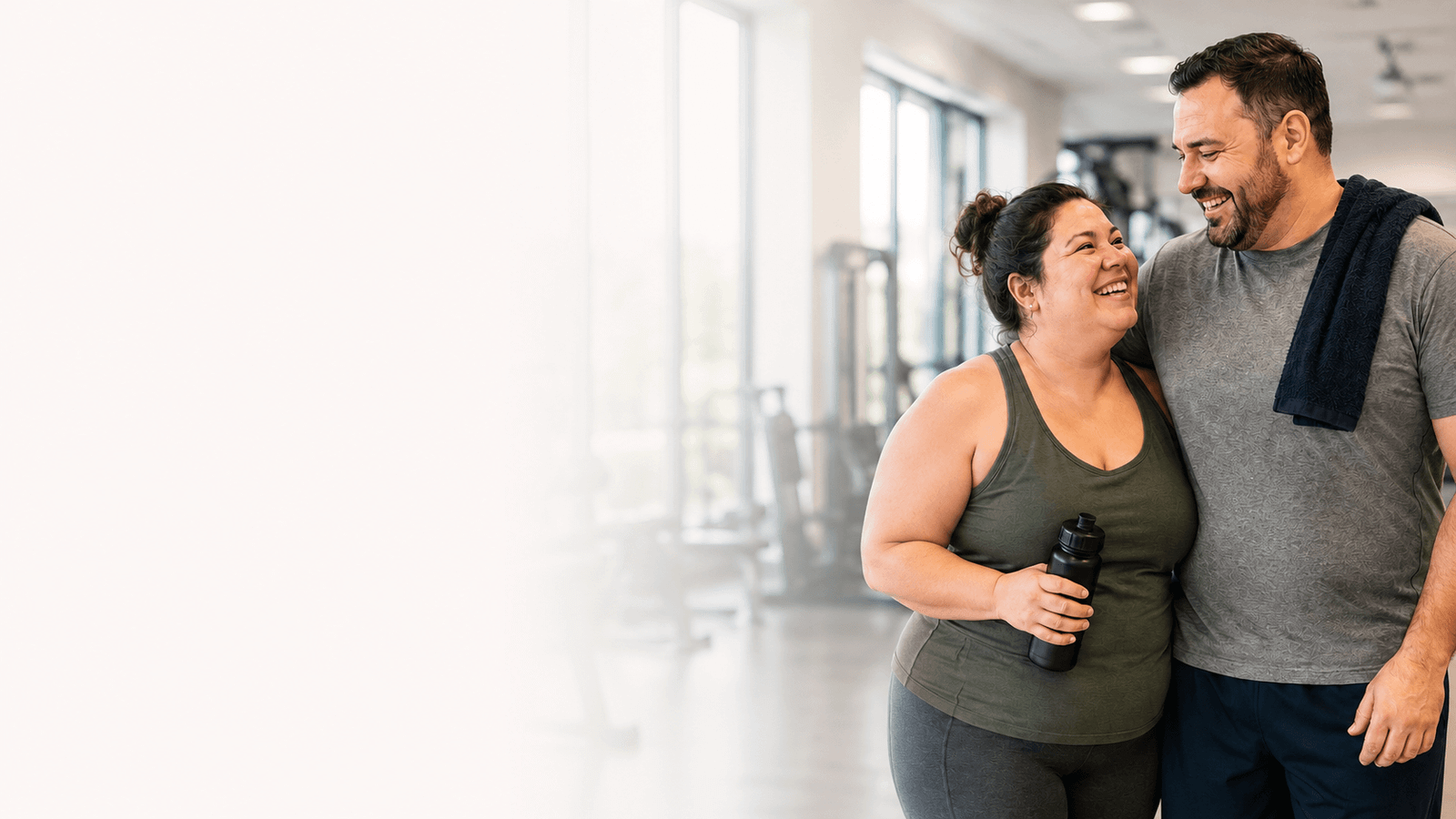 Smiling couple at a fitness centre