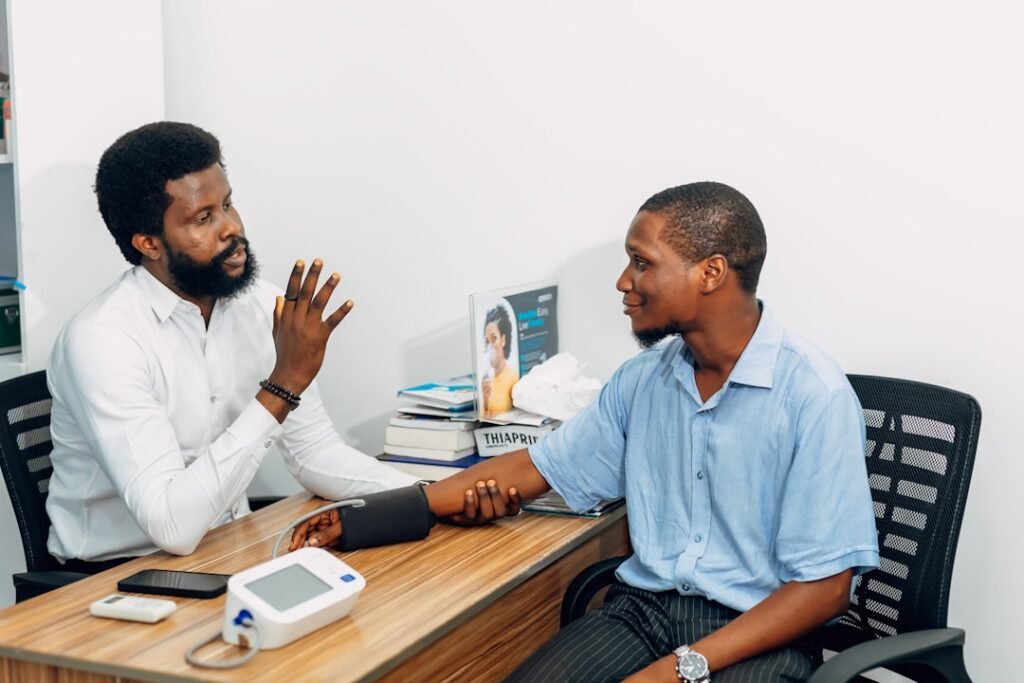 Doctor discussing enclomiphene side effects and lab monitoring with a male patient