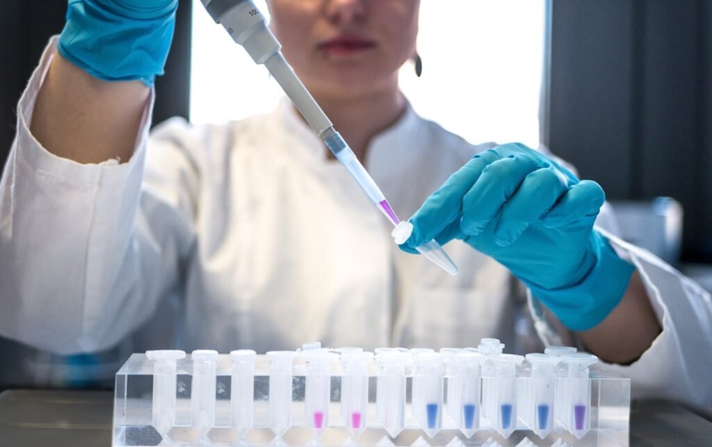 Laboratory professional preparing hormone testing for high estradiol on TRT