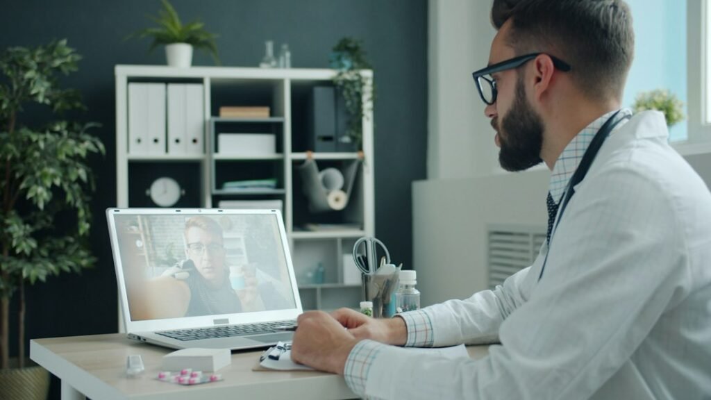 Man discussing a TRT treatment timeline during a telehealth consultation